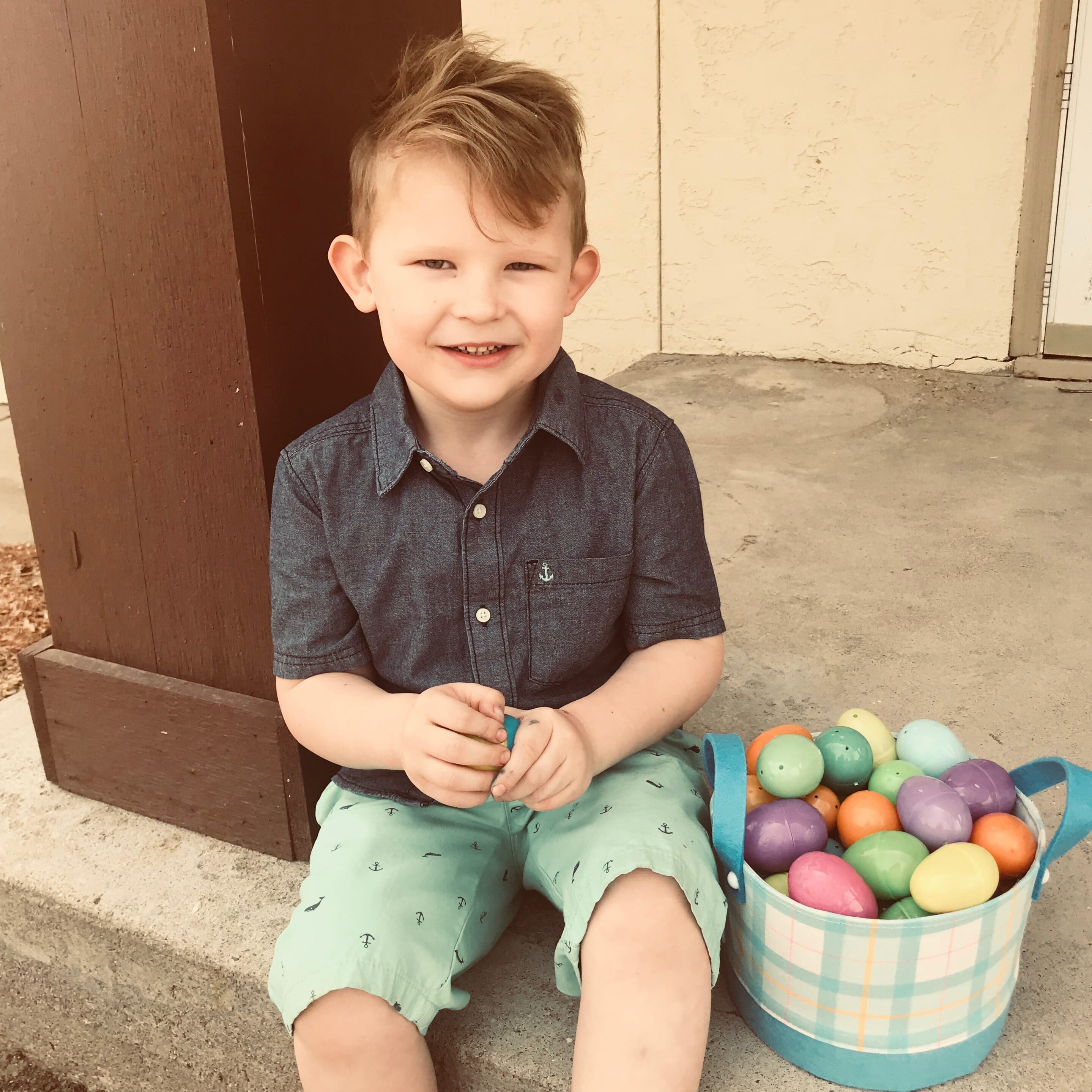 Kelli's son showing off his Easter eggs