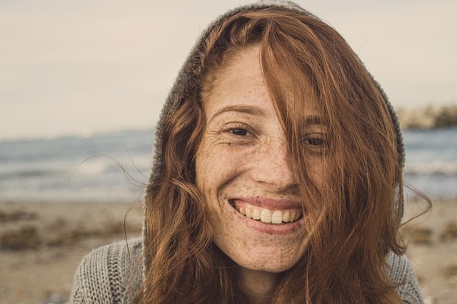 Blog Graphic for the Trial Smile: Your Path to a Confident and Smile with a Redheaded woman smiling