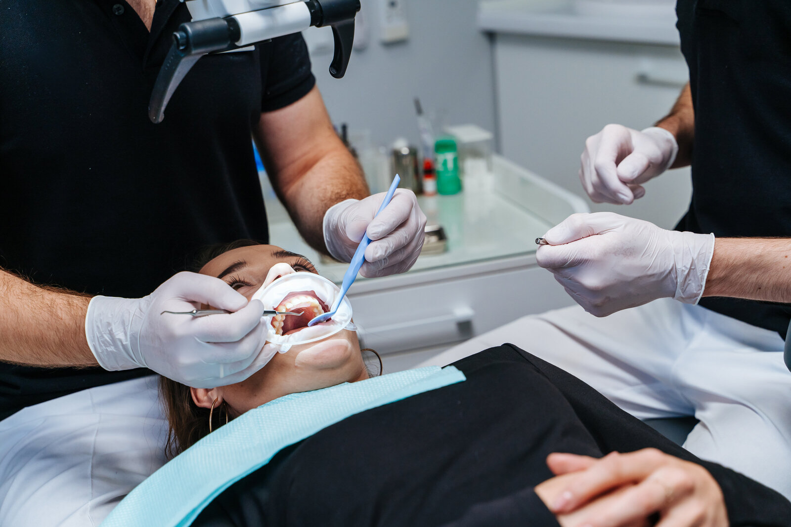 Dentist using microscope and precision tools during dental implant procedure at Randall K. McVey, DMD PA in Garden City, KS