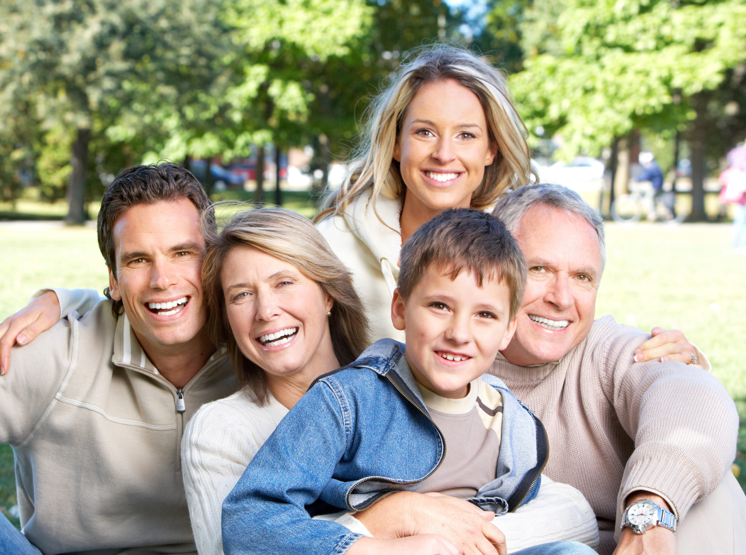 Family Dentistry for All Ages Garden City KS Family of all ages smiling together representing family dentistry at Randall K. McVey, DMD PA in Garden City, KS