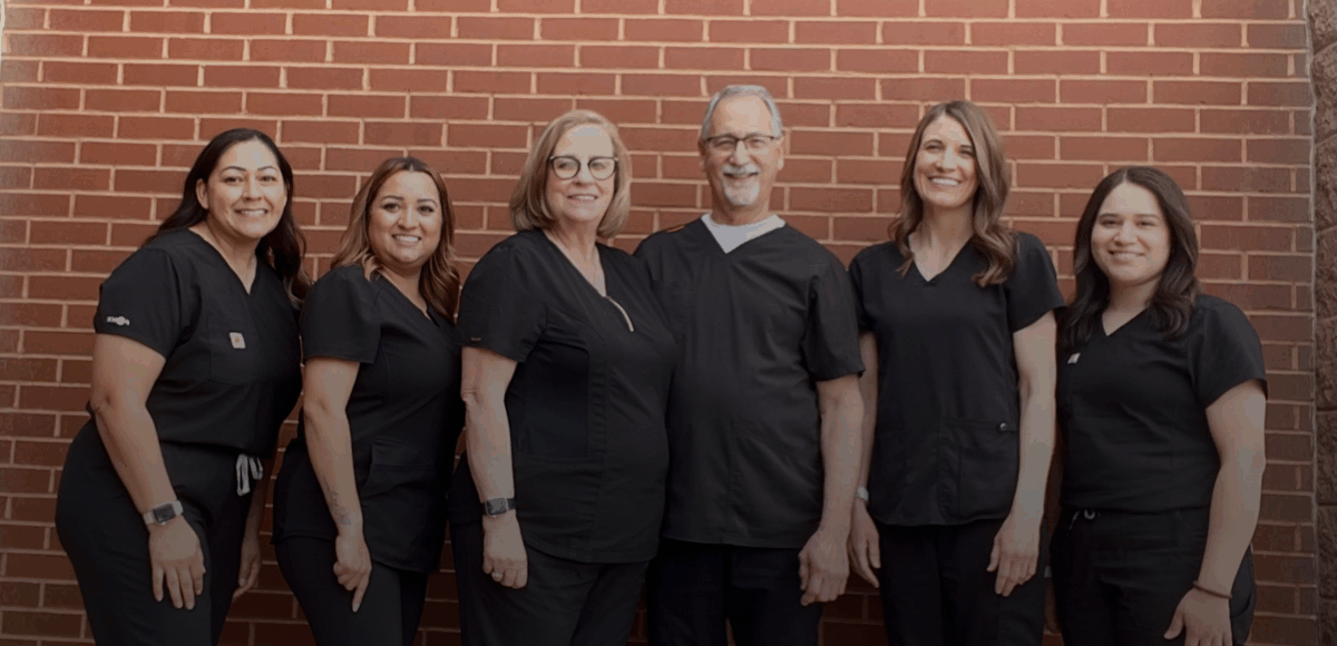 The friendly dental team at Randall K. McVey, DMD PA smiling together in Garden City, KS